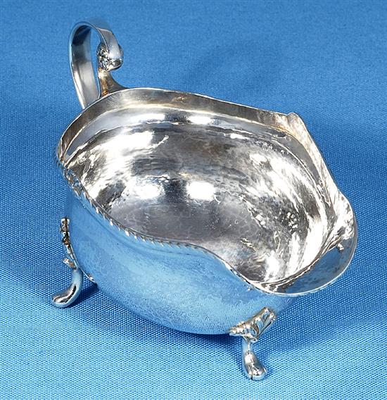 A George V Arts & Crafts silver sauce boat, by Albert Edward Jones, length 185mm, weight 7.3oz/228grms.